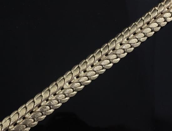 An early 1970s textured 9ct gold woven link bracelet, 19.4cm.